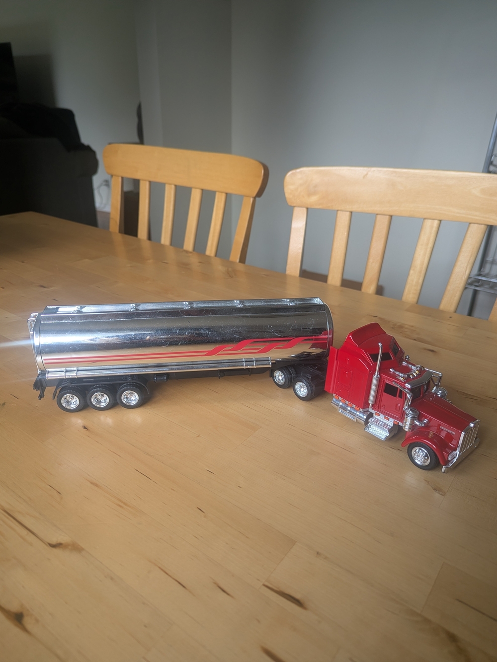 Kenworth Red Semi Truck with Chrome Tanker Trailer